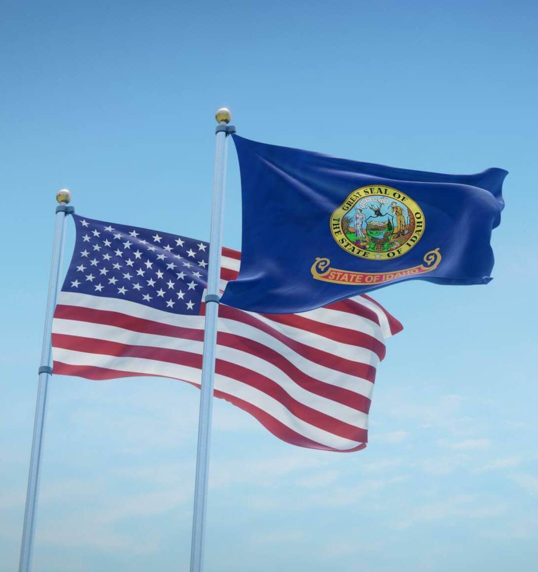 Waving Flags Of The Usa And The Us State Of Idaho Against Blue Sky Backdrop. 3d Rendering